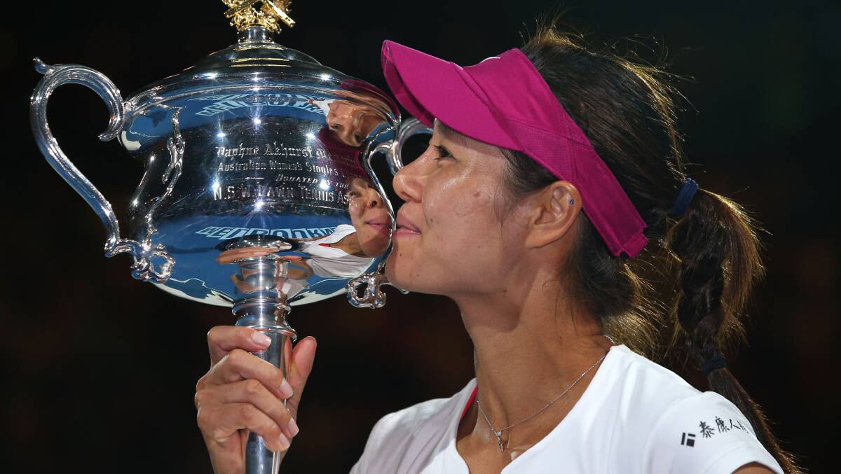 Li Na kisses the Daphne Akhurst Memorial Cup after winning the women's final against Dominika Cibulkova at Rod Laver Arena. Picture: GETTY IMAGES