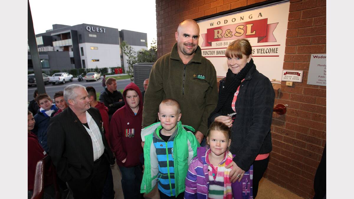 Hamish and Jessica Robinson from Wodonga with their children Lachlan, 6 and Matilda, 4. They were in line for a big breakfast at the RSL Club.