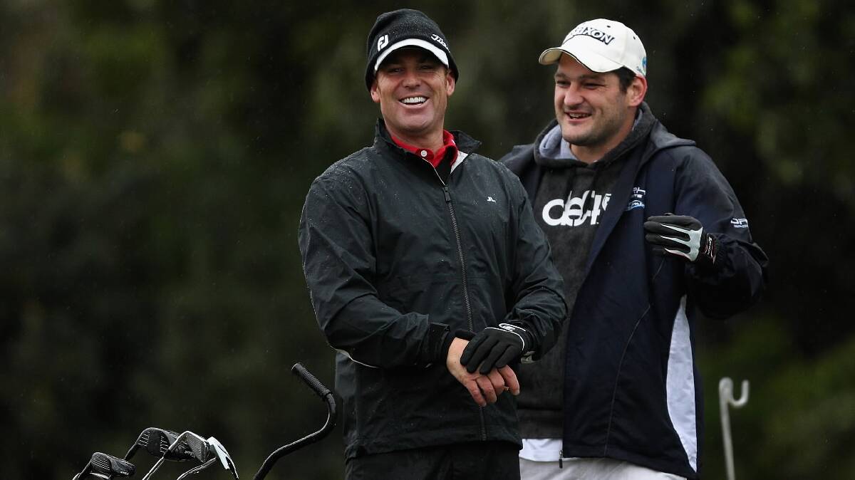Yarrawonga star Brendan Fevola shares a joke with good mate, and Australian Test cricket great, Shane Warne during the ProAm ahead of last November’s Australian Masters in ­Melbourne. Pictured: GETTY IMAGES