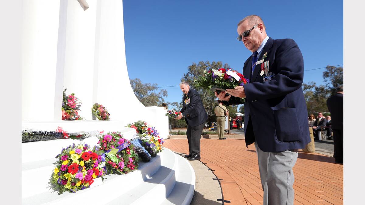 Niel Russell lays a wreath.