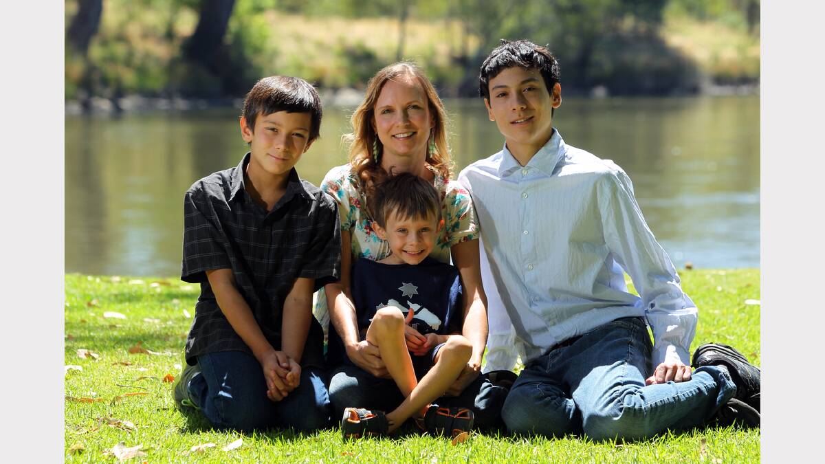  Noreuil Park, Albury. Australia Day 2014. Wendell McFarland, 11, Laura Piazza, Van Piazza, 4-and-a-half, and Foster Mcfarland, 18. (Laura is the boys' mother). Laura and the two older boys, originally from the US, became Australian citizens at a ceremony on Australia Day.