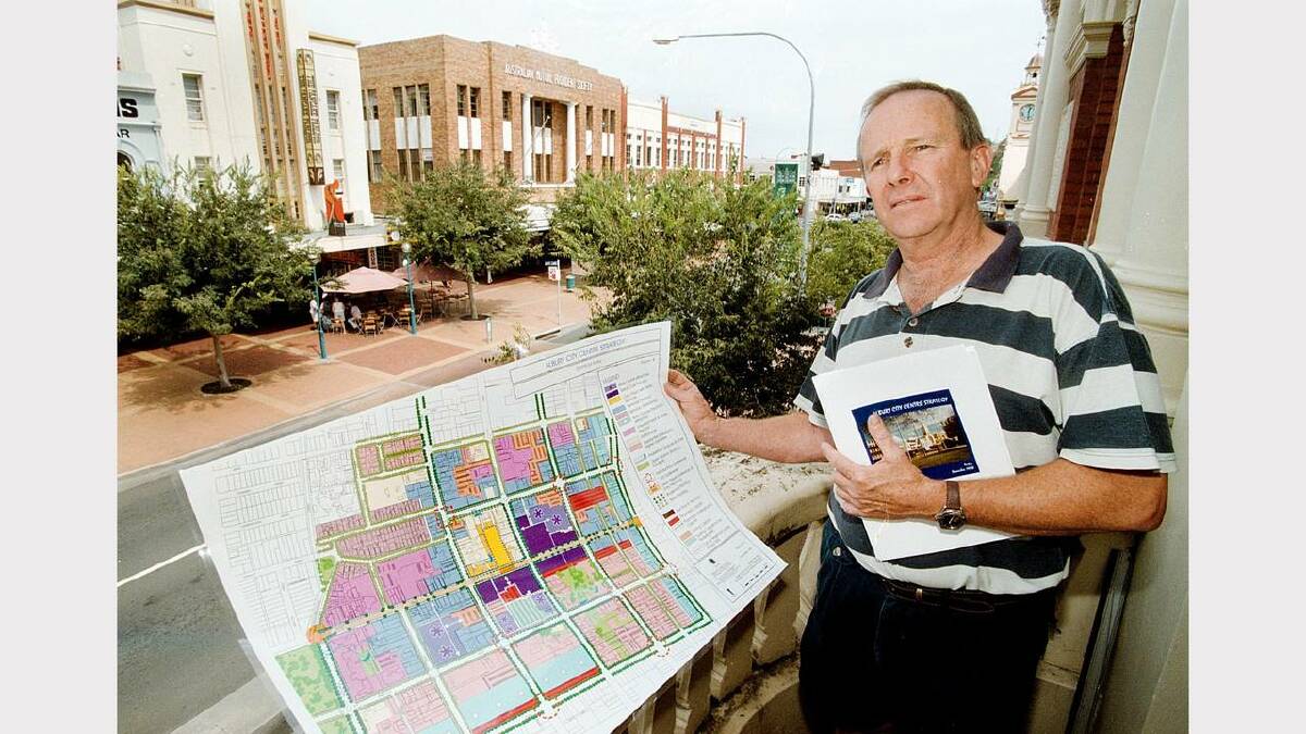 Tym Travis, chairman of Albury Central Traders, re proposed plan for Albury's CBD. That's Dean Street, Albury, in the background. Picture: PETER BATSON