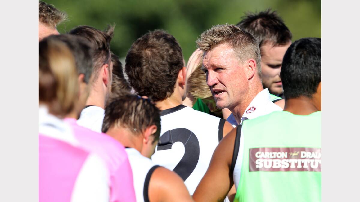 Nathan Buckley addresses his team.