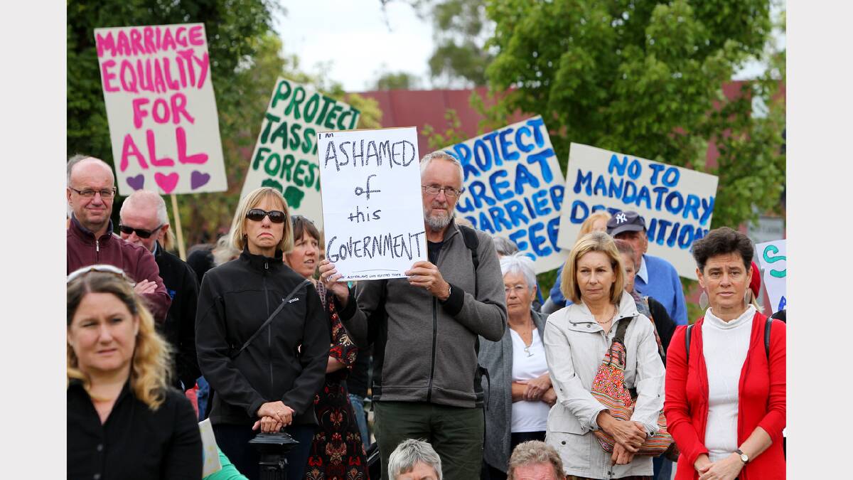 Michael Webster, of Chiltern, shows his support at the March in March protest objecting to the Abbott Government, held in Woodland Grove, Wodonga.