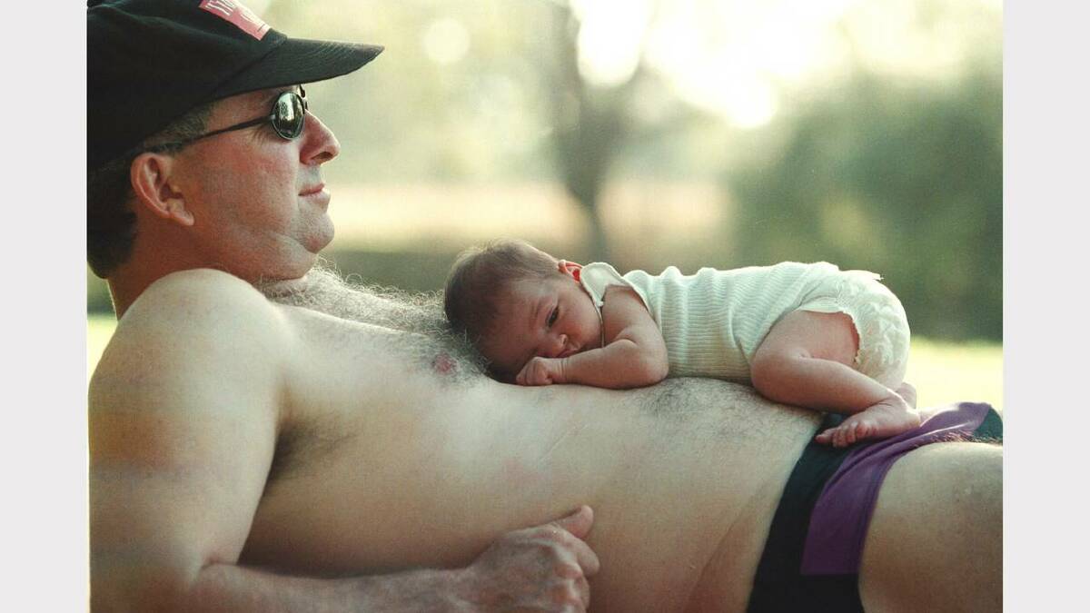 Michael Neville and daughter Meg, 12 days old, at Noreuil Park, Albury. Picture: PETER BATSON