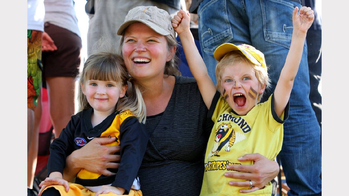 Maggie, 3, Alysa and Jack Forbes, 5, of Melbourne, were cheering for the Tigers.