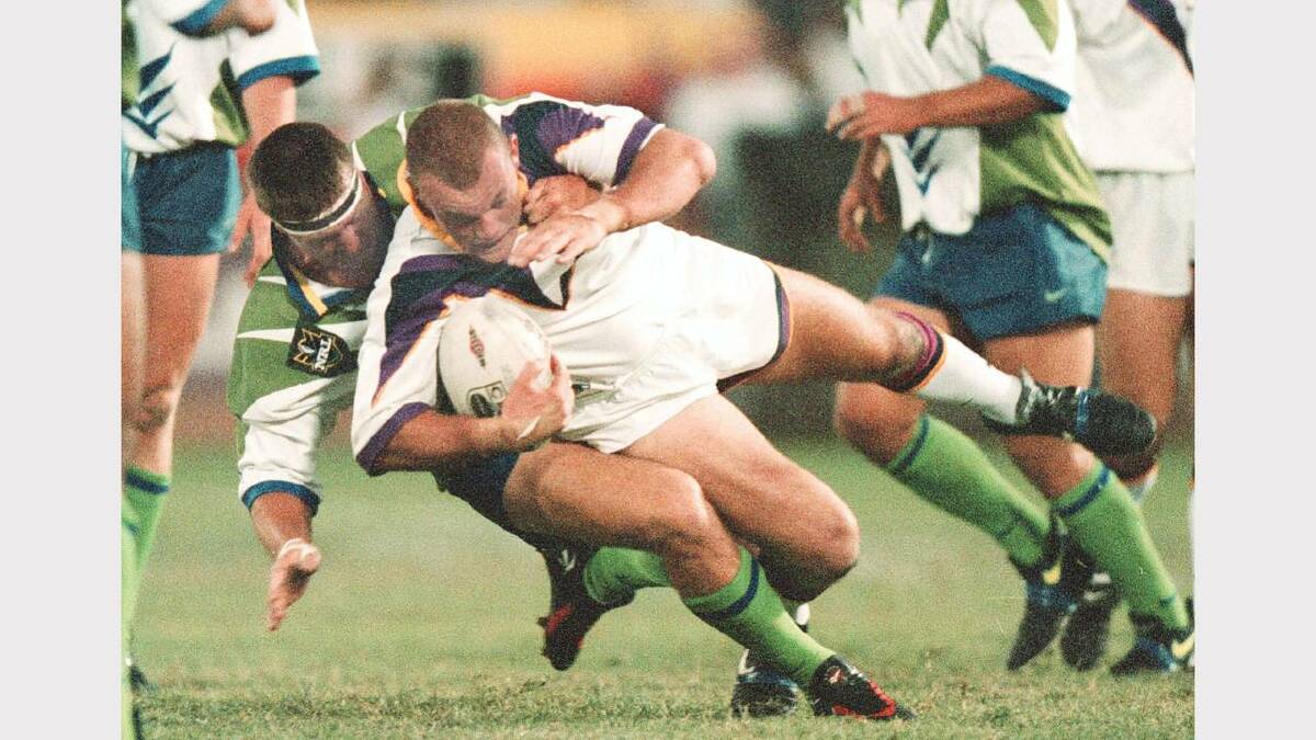 Canberra Raiders vs Melbourne Storm at Lavington Sports CLub.  David Furner sends Melbourne's Ben Roarty to the ground