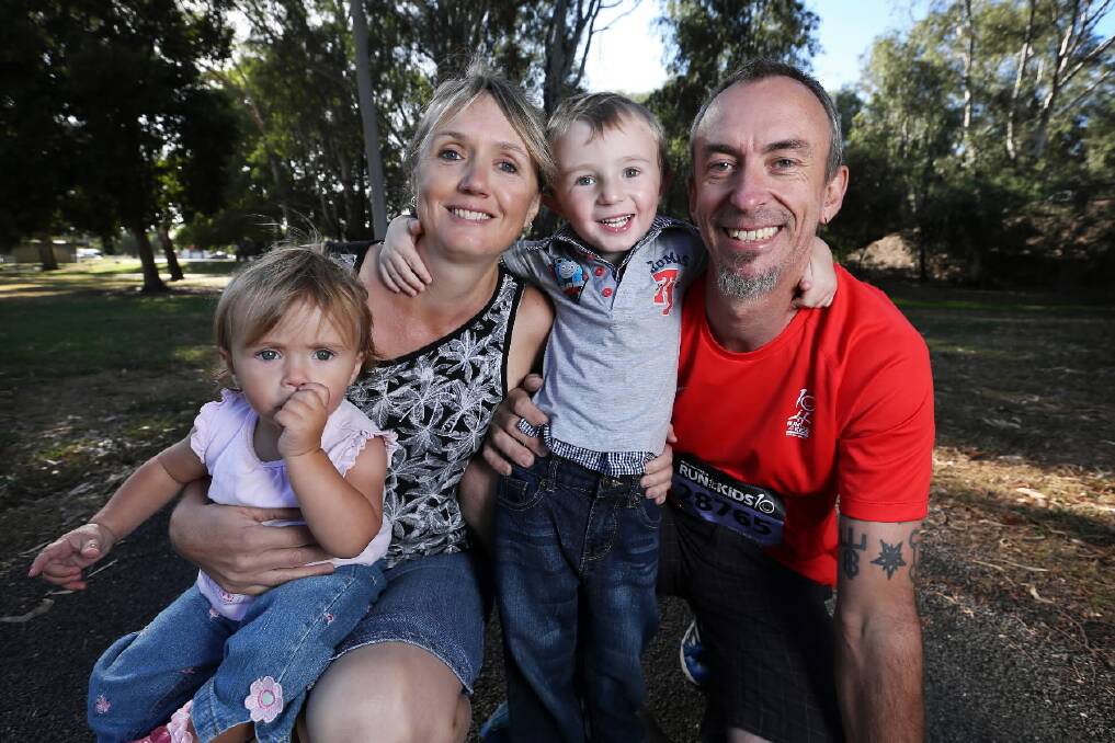 Lisa and Shane Hack and children Ana, 1, and Eli, 3, of Wangaratta, are counting their blessings every day. Eli has endured three open-heart surgeries and Shane will do the Royal Children’s Hospital fun run in Melbourne tomorrow in his honour. Picture: MATTHEW SMITHWICK