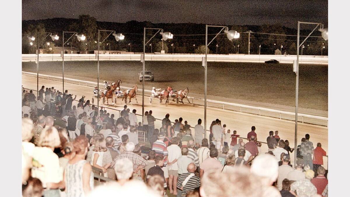 A typically large crowd watches the Albury trots meeting. Picture: ALEX MASSEY
