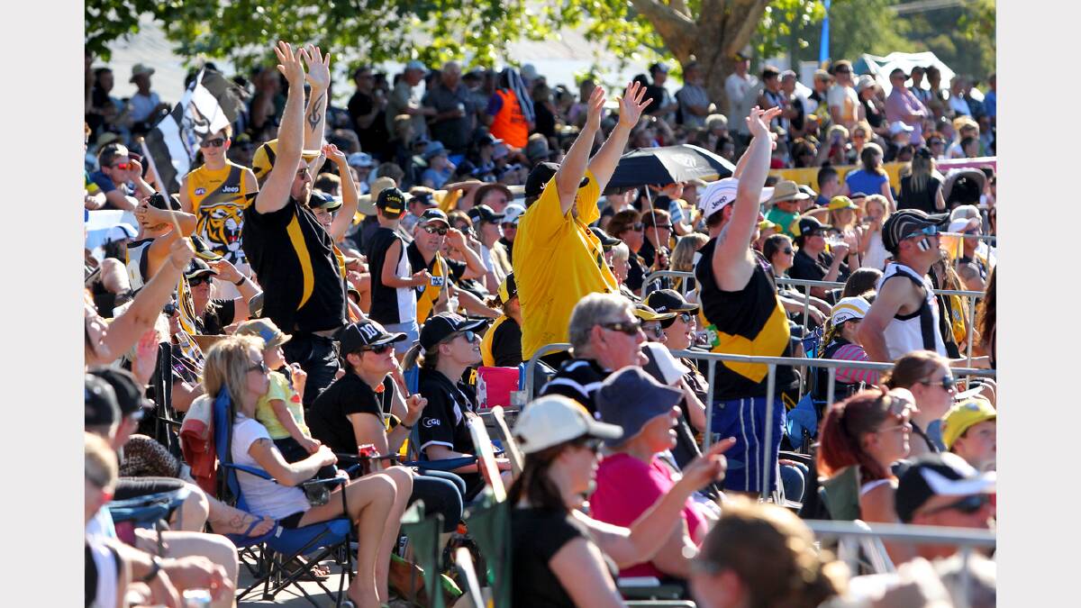 Richmond supporters behind the goals react at the Norm Minns Oval, Wangaratta.