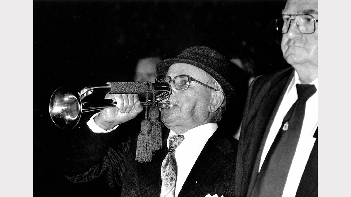 The bugler blows The Last Post at the 1990 Wodonga dawn service.