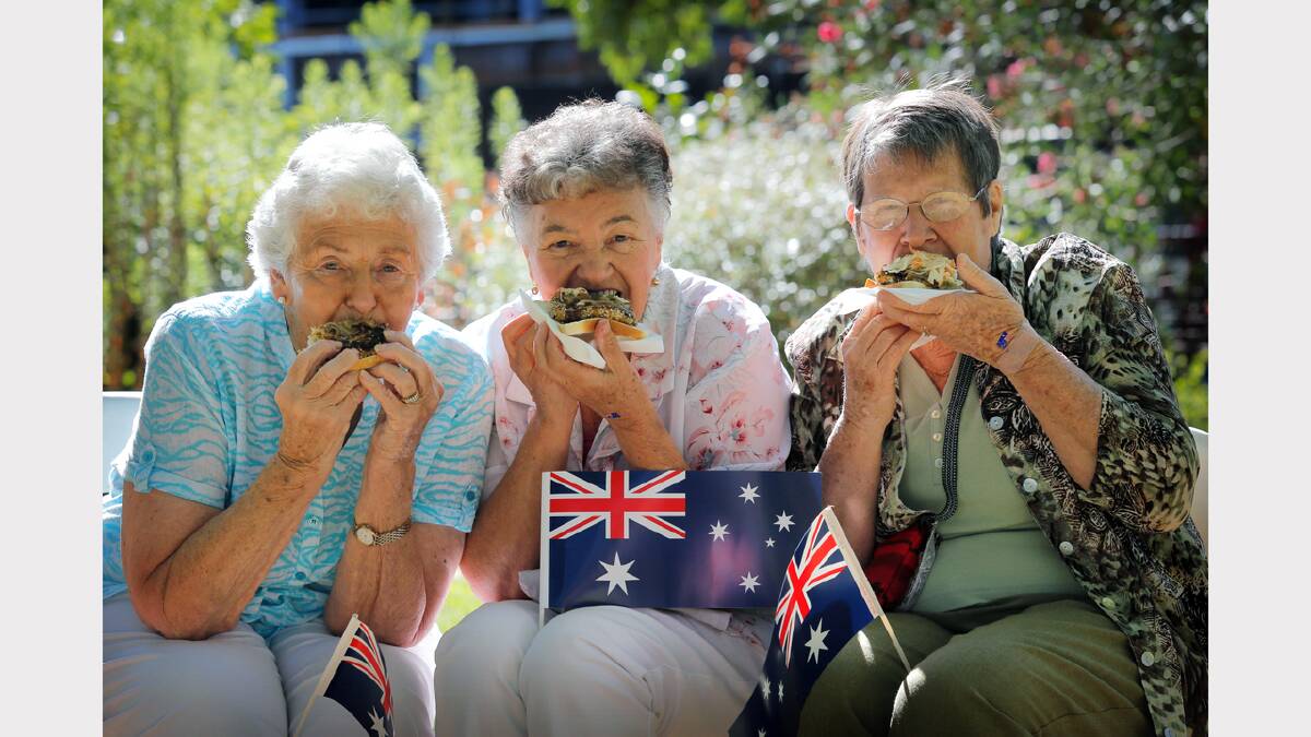 L-R: Elaine Sunderland, of Strathmore, Shirley Deed, of Broadmeadows (formally of Wangaratta), and Bev Bradley, of Wangaratta, tuck into the free BBQ after the ceremony.