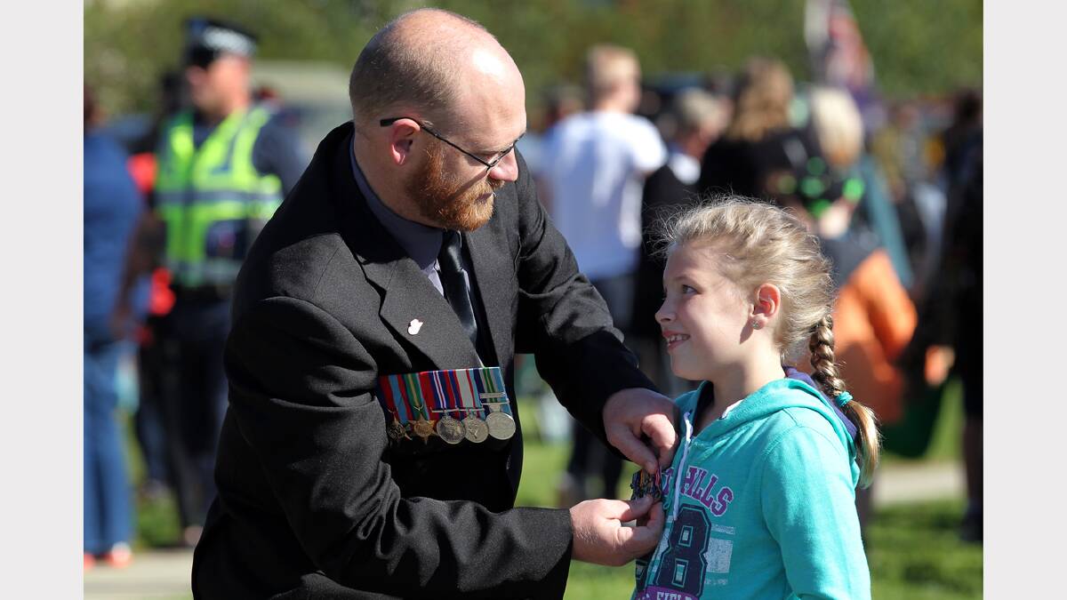 Wodonga Anzac Day march. Dale Skinner from Wodonga and his daughter, Lily, 8 from Avenel.
