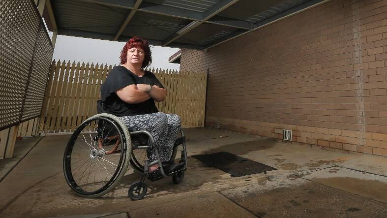 Karen Pereira had her gold coloured 2001 Holden Commodore - fitted with special equipment to help her drive - stolen from her driveway last night. Picture: TARA GOONAN