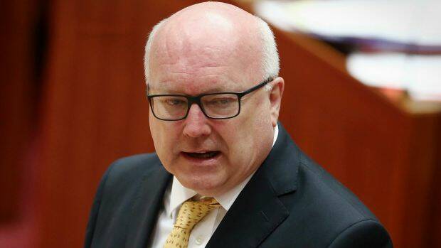 Attorney-General George Brandis will have the power to block legal action or appeal an injunction. Photo: Alex Ellinghausen
