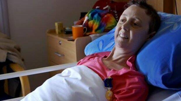 Connie proudly wears her Medal of the Order of Australia in her hospice bed in Canberra. Photo: facebook/loveyoursister