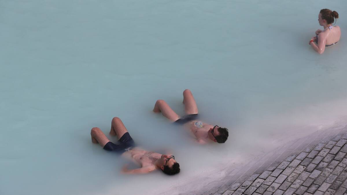 Visitors sit in the geothermal waters at the Blue Lagoon close to the Icelandic capital of Reykjavik on April 7, 2014 in Reykjavik, Iceland. Pic: Getty Images