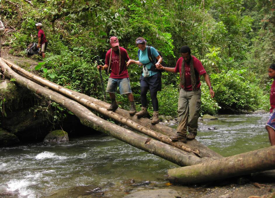 Porters are always on hand to help with tricky river crossings. PHOTO Loredana  Citraro.