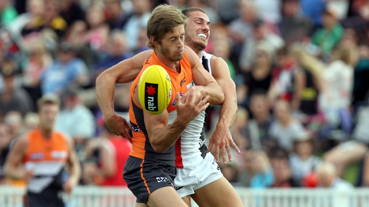 AFL: St Kilda's Nathan Wright clashes with Giants' Callan Ward. Picture: Les Smith