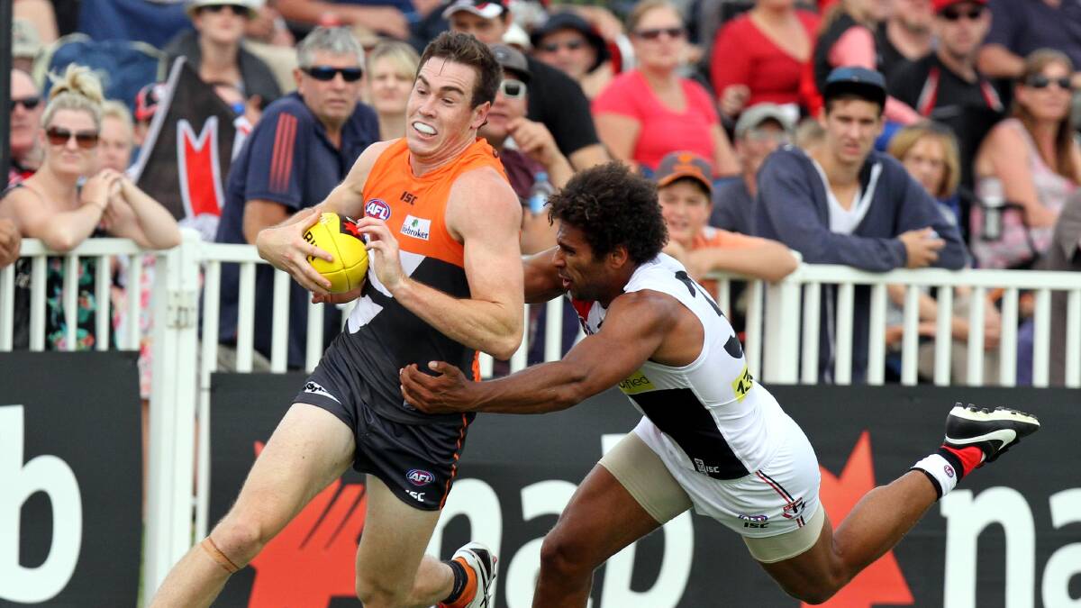 AFL: Giants' forward Jeremy Cameron attempts an escape from St Kilda's James Gwilt. Picture: Les Smith