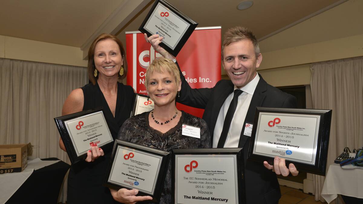 Maitland Mercury sales manager Sue Prescott, editor Eve Nesmith and Business Manager Newcastle/Hunter and New England Jason King with the Mercury's share of editorial awards. Picture by Stuart Scott
