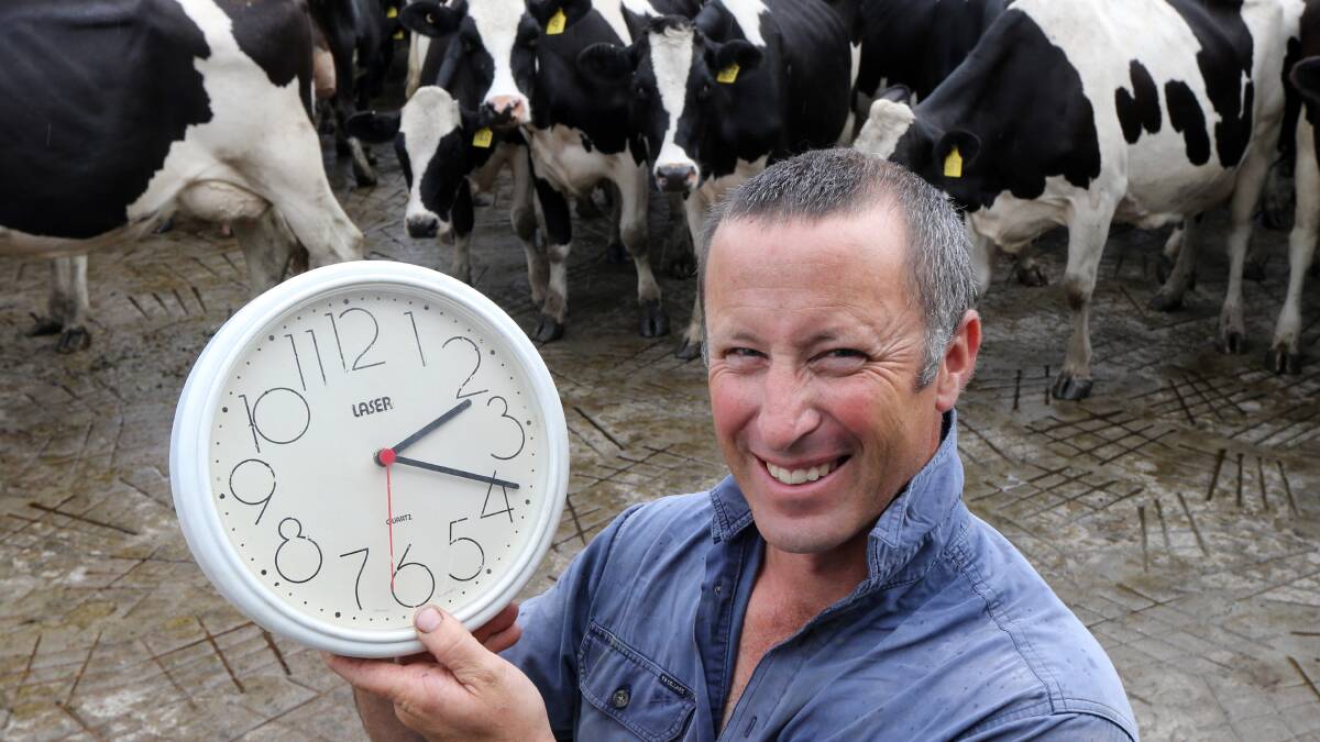 Stuart Crosthwaite sets the time ready for Sunday morning, when we all need to turn our clocks back one hour. However, cows want to be milked at around 5:30am irrespective of daylight savings time. Picture: PETER MERKESTEYN