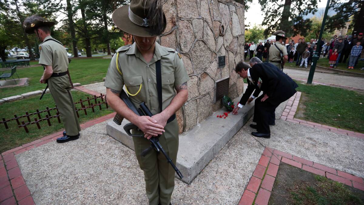 Poppies are laid at the cenotaph during the Anzac Day ceremony at Beechworth. Picture: MATTHEW SMITHWICK