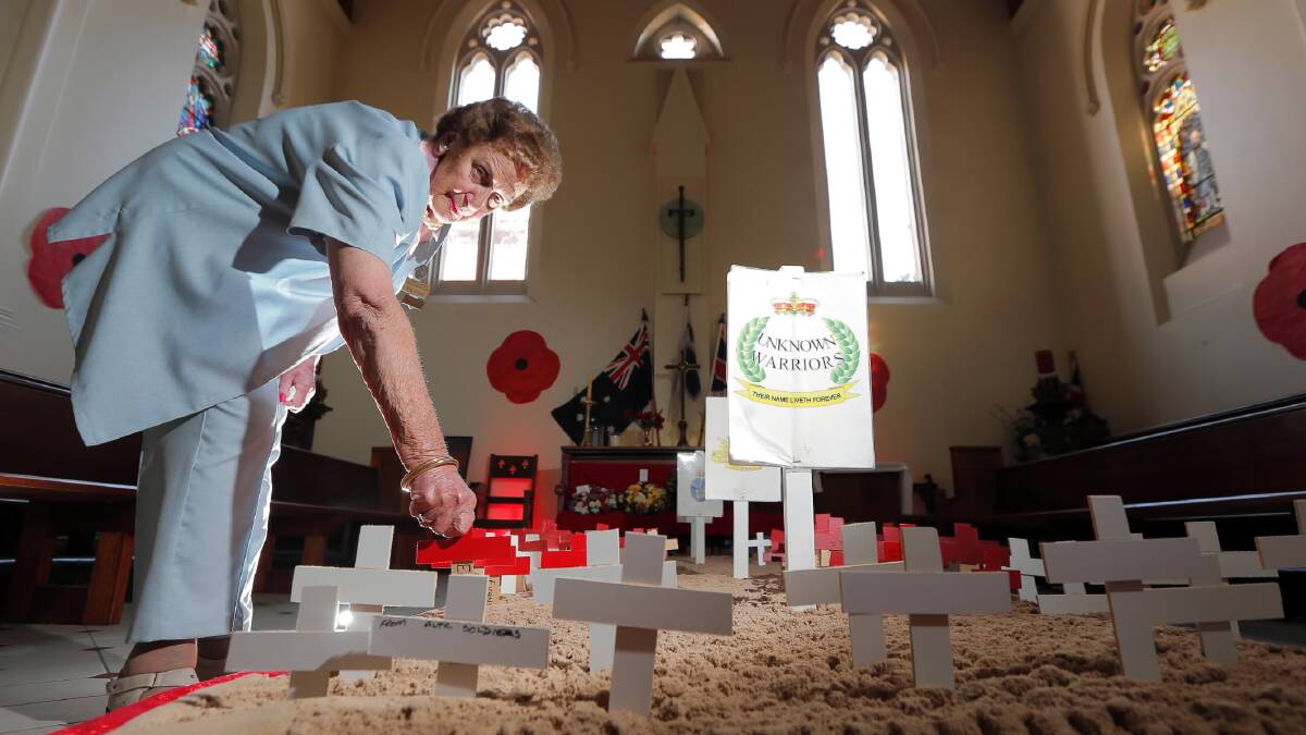 Val Evans at the field of remembrance in Albury’s St Matthew’s Anglican Church. Picture: KYLIE ESLER