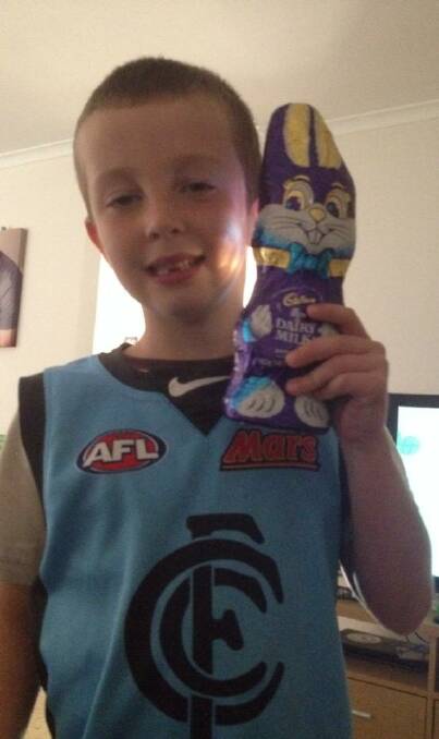 Oliver Killeen proudly holds a present from the Easter bunny. - CLAIRE KILLEEN (Facebook)