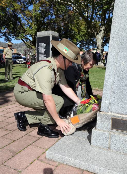 Major Lisa-Jo Laing and Mary Fraser lay wreaths at the Tallangatta service. Picture: PETER MERKESTEYN
