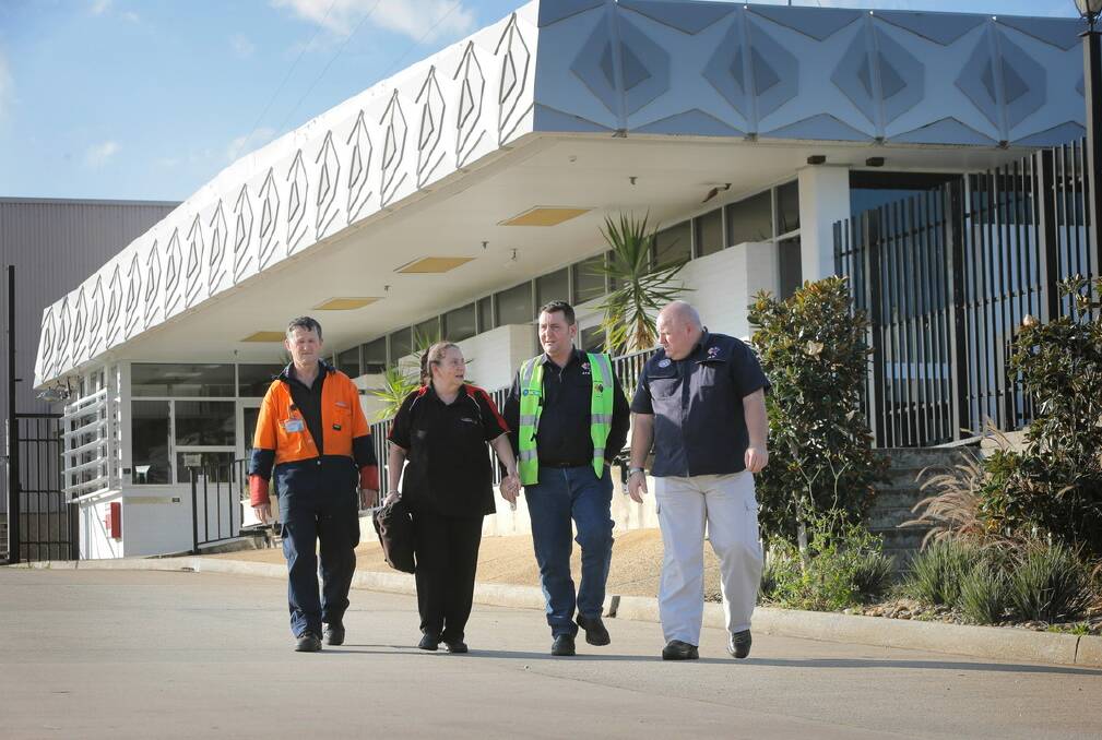 DSI employees Terry Meredith and Marilyn McMillan leave after the meeting with AMWU National Assistant Secretary of the Vehicle Division Warren Butler and Regional Secretary of the NSW Vehicle Division Sean Morgan. Picture: TARA GOONAN