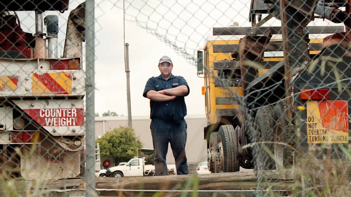 Leigh Gray at Finemore's truck depot, where wheels and tyres have been stolen. Picture: RAY HUNT