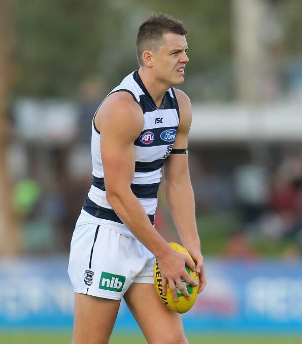 (February) Hamish McIntosh warms up for the Cats before the round three NAB Challenge match against Melbourne. Picture: GETTY IMAGES