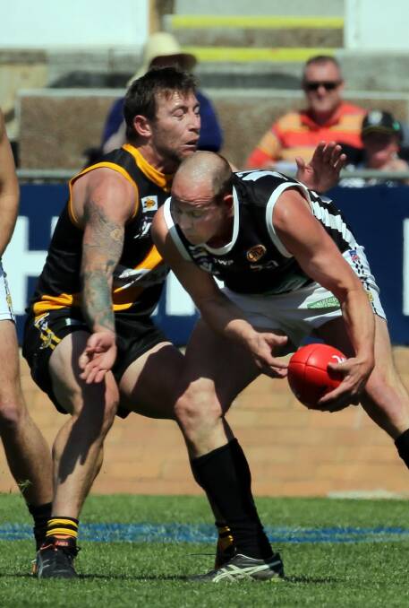  Albury's Josh Maher attempts to block Wangaratta's Dave Thayer. Picture: PETER MERKESTEYN