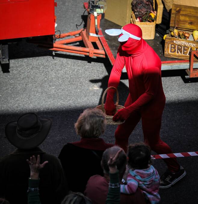  Beechworth Bakery's morph suit man throws lollies to the crowd.