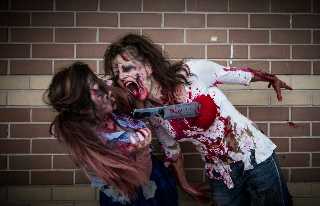 Albury Zombie Walk. Eddie Deans and Karen Deans attempt to eat each other. Picture: DYLAN ROBINSON