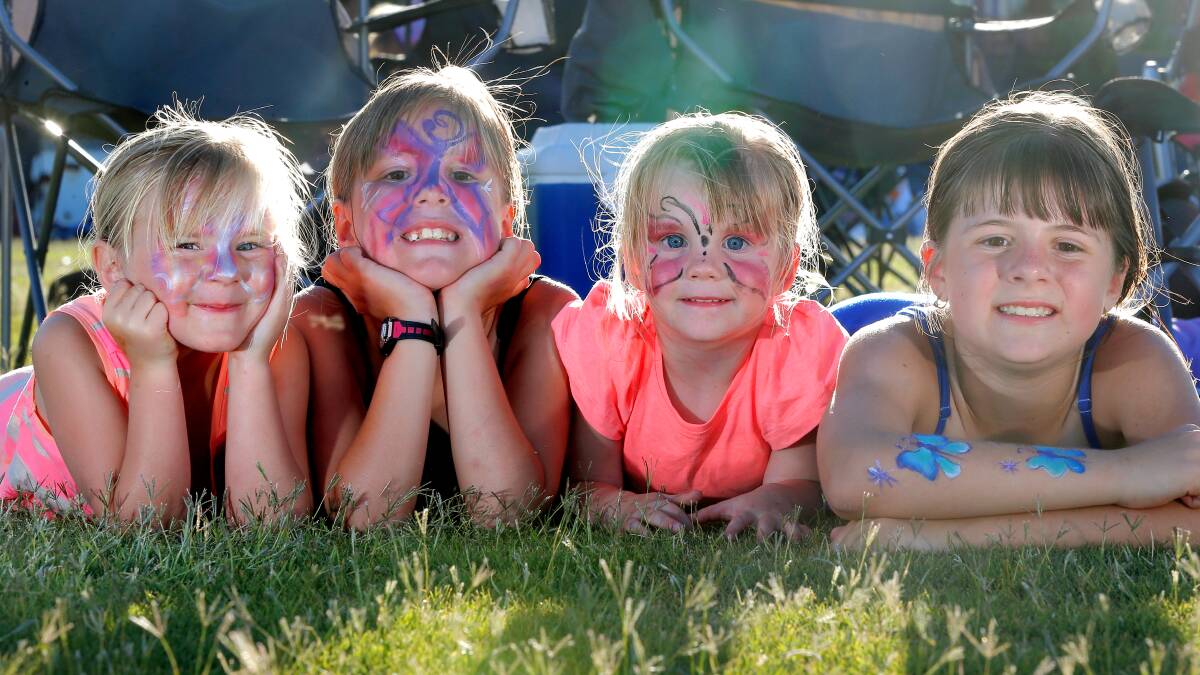 BIRALLEE PARK: The Pullen sisters Lilly-Ann, 5, Tahlia-Jane, 8, Eryn, 2, and Emma-Lee, 9, got their faces (and arm) painted. Picture: TARA GOONAN