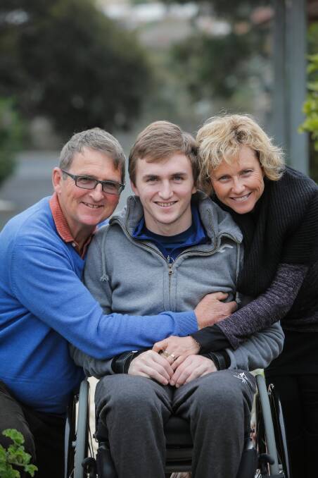 James McQuillan with his parents Jack and Jo. Picture: TARA GOONAN