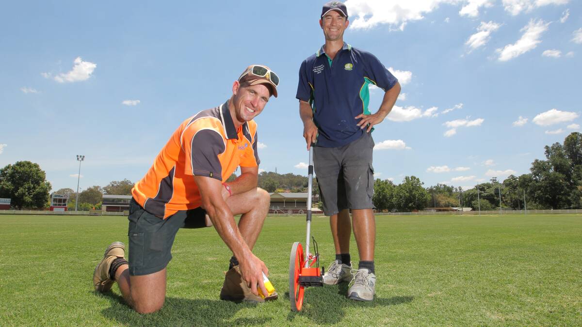 Curators Luke Garland and Shayne Ried will help prepare the court for a tennis match to mark the 100th anniversary of the Albury Easter Tennis Tournament. Picture: DAVID THORPE