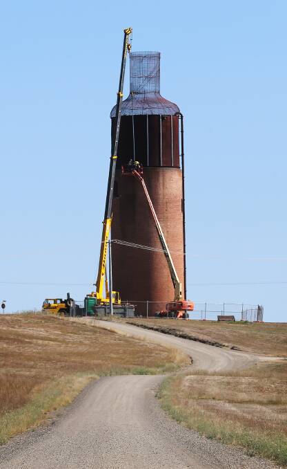 Work is being carried out to restore the bottle top on Rutherglen's water tower. Picture: JOHN RUSSELL