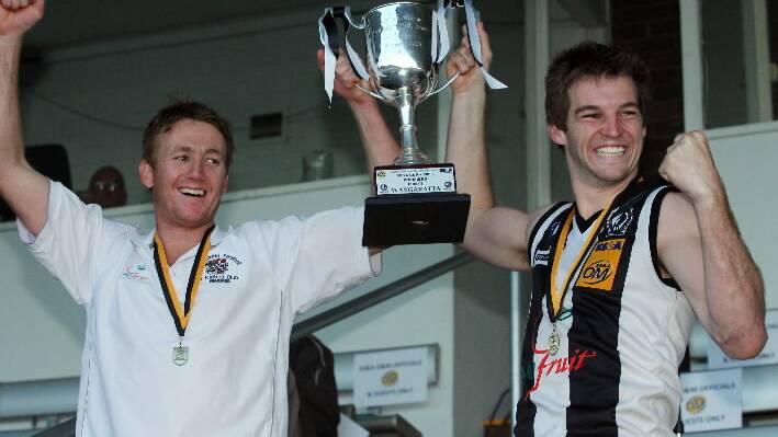 Porter and then-coach Jason Lappin enjoy the spoils after Wangaratta won the 2008 premiership. Picture: MATTHEW SMITHWICK