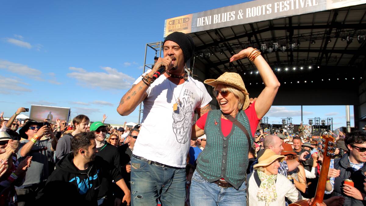  Michael Franti didn't shy away from the crowd. He spent much of his set dancing on a box with thrilled audience members such as Valerie Tepper, from Flowerdale.