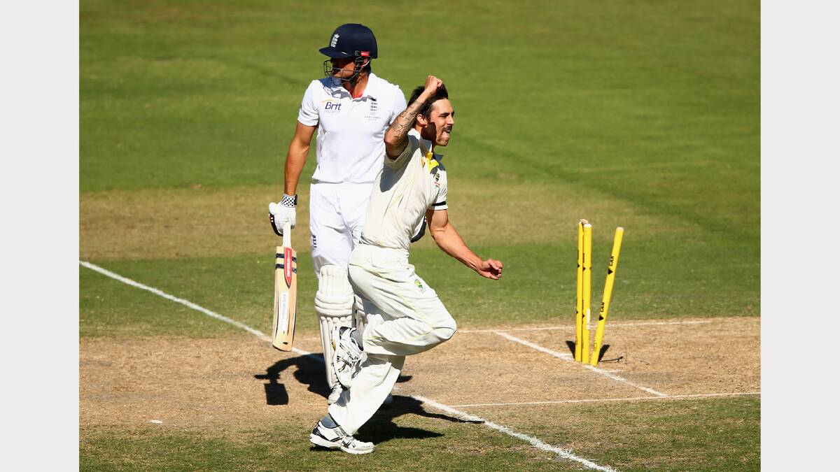 Mitchell Johnson of Australia celebrates after he took the wicket of Alastair Cook of England. Picture: GETTY IMAGES