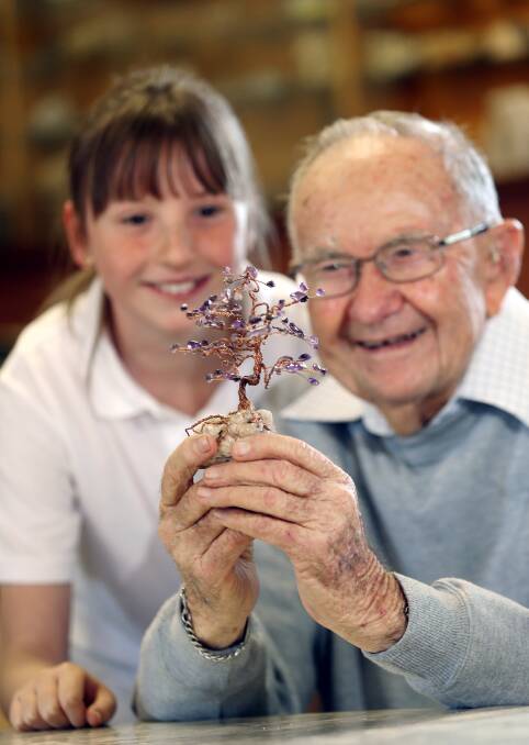  Albury's Sophie Lee, 10, and founding member Bill Stirling, 90,  with their precious gem tree. Picture: JOHN RUSSELL