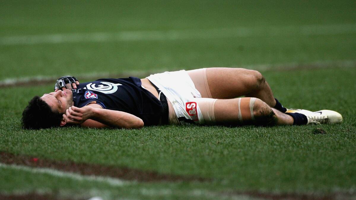 Brendan Fevola lies motionless after a big hit against Hawthorn in 2006. Picture: GETTY IMAGES