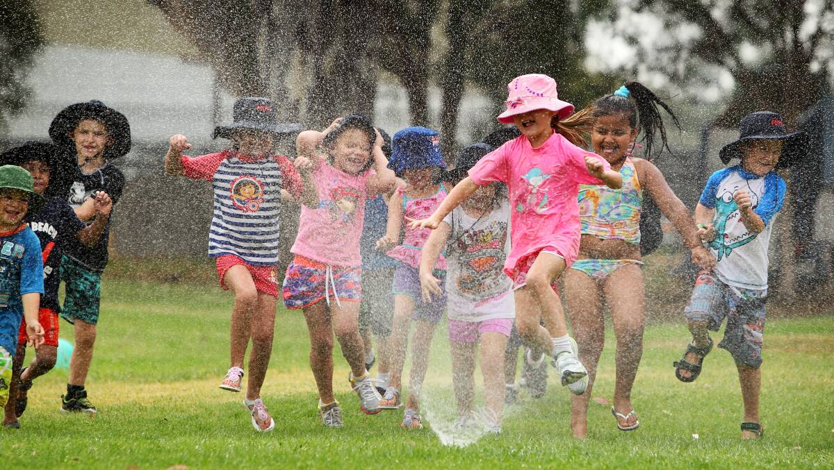 Albury North Public School students enjoy the classic Aussie past-time of running through the sprinkler during the school's water sports day. Picture: MATTHEW SMITHWICK