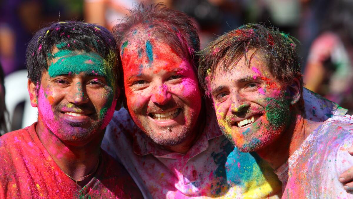 Albury's Harpreet Singh, Tyrone Russell-Smith and Aaron Bykerk take part in the Indian festival of Holi, where coloured powder is thrown over one another. Picture: MATTHEW SMITHWICK
