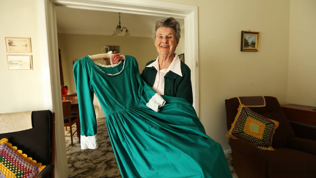  Judy Brindley holds the dress she wore while playing the role of the Jerilderie Hotel Barmaid in the production of Ned Kelly, the first local production held in the then Albury War Memorial Civic Theatre. Picture: MATTHEW SMITHWICK