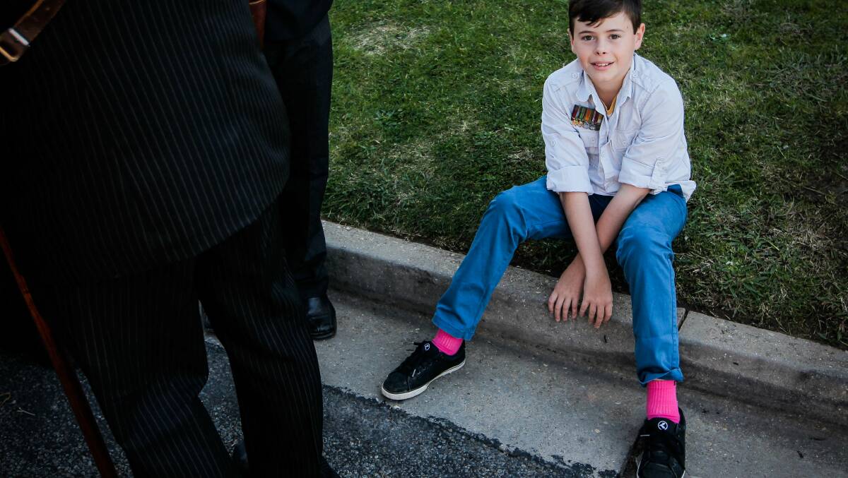  Yarrawonga'as Ryan Bird, 13, sits before the march wearing his grandfather's medals.Picture: DYLAN ROBINSON