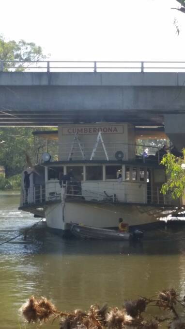 The paddlesteamer on its second attempt trying to squeeze under the bridge. Picture: LIZ EATON
